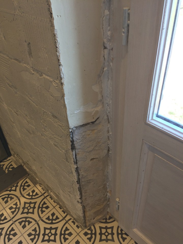 Old limestone, new door, walls to be restored.