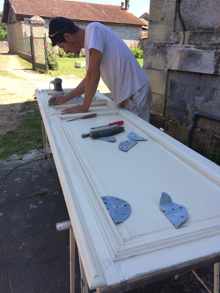Arduous tasks, painstaking refinishing, ancient doors.